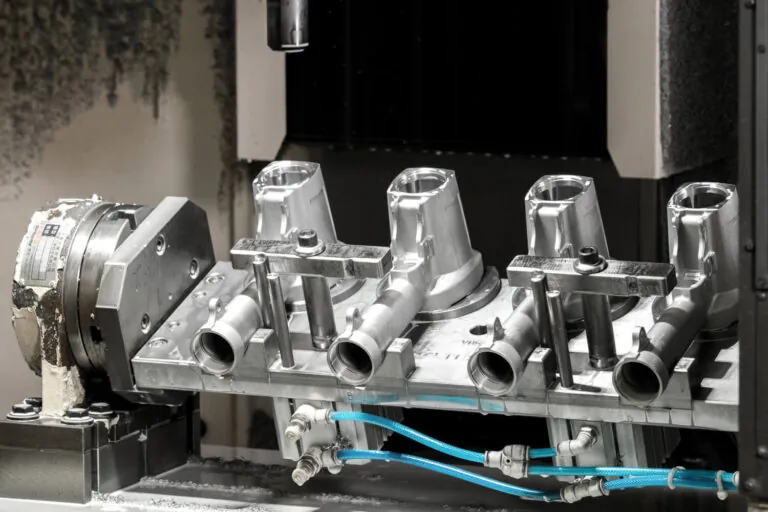 Multi-station CNC fixture for simultaneous precision drilling and milling of aluminum Pneumatic Tools and engine components.