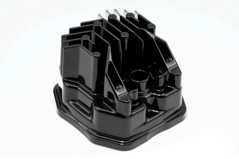 Custom black and white liquid coating on aluminum die cast LED housings, providing aesthetic finishes and durable protection for OEM products.