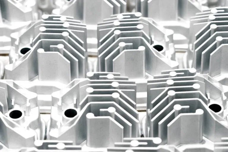 Precision-engineered aluminum die cast LED heat sinks arranged for automated Shot Blasting to ensure optimal thermal dissipation for high-power lighting fixtures.