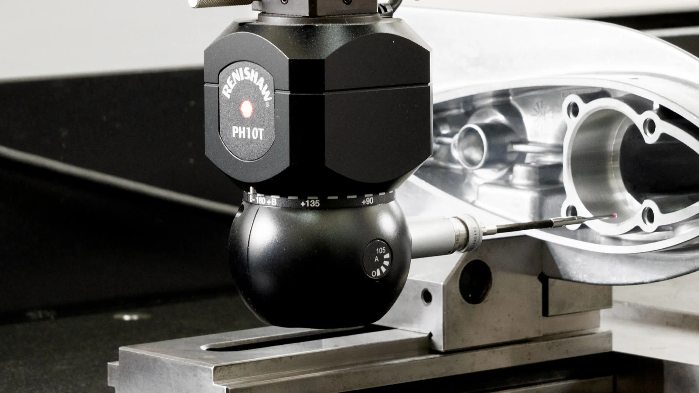 Mitutoyo CMM sampling and Renishaw PH10T probe performing automated dimensional verification on a precision aluminum die cast marine component.