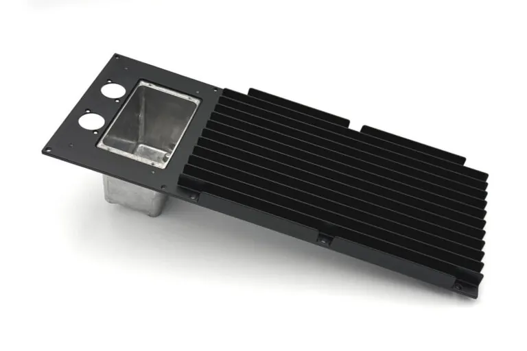 Large-format aluminum die-cast heat sink assembly with an integrated controller compartment for streamlined power electronics housing.