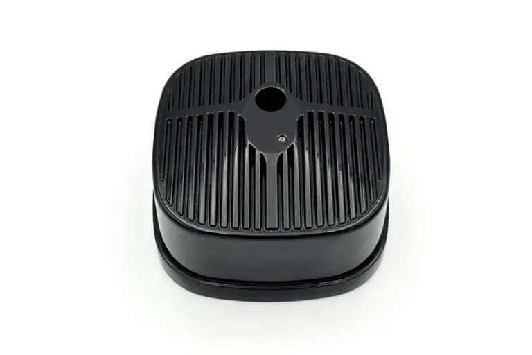 Detailed view of a black finished aluminum die casting with integrated cooling fins designed for high-performance thermal management.