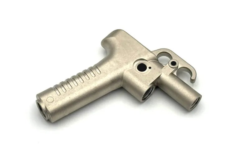 Precision-machined aluminum pneumatic tool handle featuring ergonomic grip contours and integrated trigger mounting points.